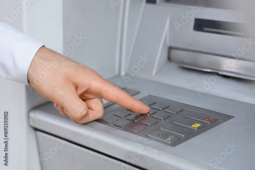 Male hand entering card's P...