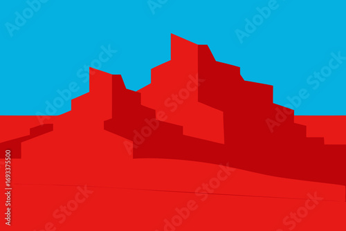 Abstract geometric red rock formations against a bright blue sky