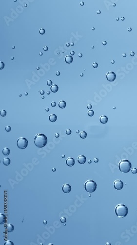 Wallpaper Mural Bubbles rising up. Boiling water, macro. Blue tone. Vertical footage Torontodigital.ca