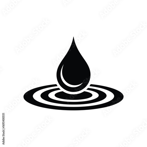 Black water drop creating ripples on white background