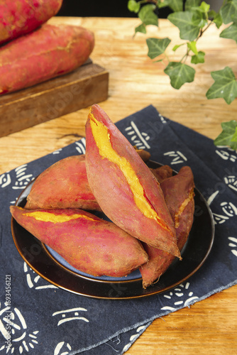 Baked Sweet Potatoes Display on Wooden Base with Fresh Kitchen Setting