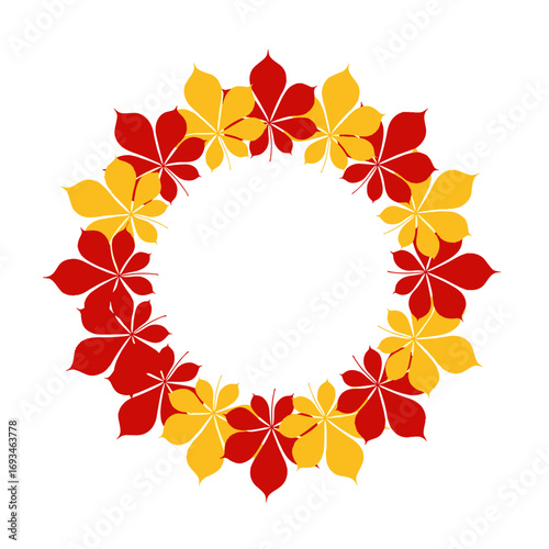 Decorative circular arrangement of autumn horse chestnut leaves in red and yellow colors forming a wreath border
