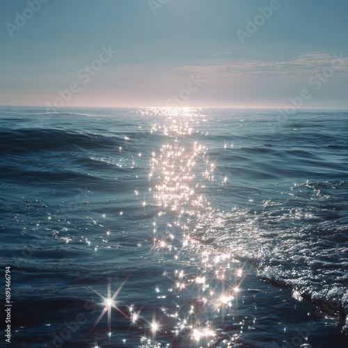 sparkling sunlight over calm ocean