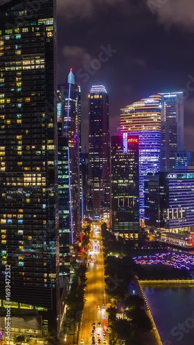 night time illuminated singapore city downtown bay aerial vertical panorama 4k timelapse