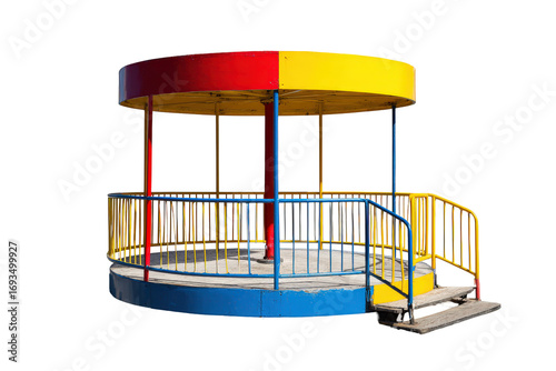 Colorful childrens merry go round playground equipment isolated on white.