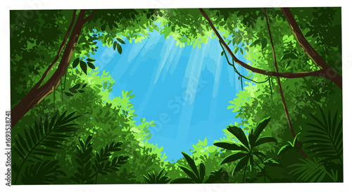 Jungle canopy view upwards with green foliage and blue sky sun rays shining through