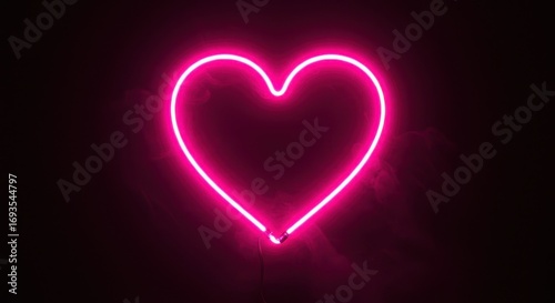 A vibrant, glowing neon heart shape illuminates a dark background, evoking a sense of romantic warmth and visual appeal.
