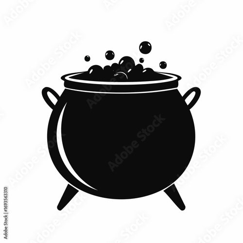 A black cauldron boiling a potion with bubbles. The image captures a symbol of magic and mystery.