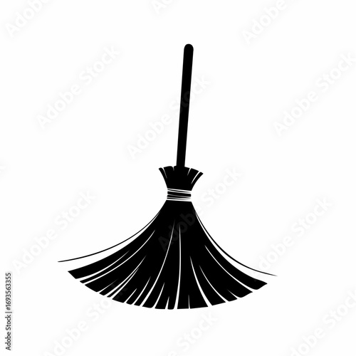 Silhouette of a classic broom against the backdrop