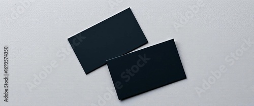 Two sleek black business cards mockups on a rustic grey wood background,  texture background,  cards