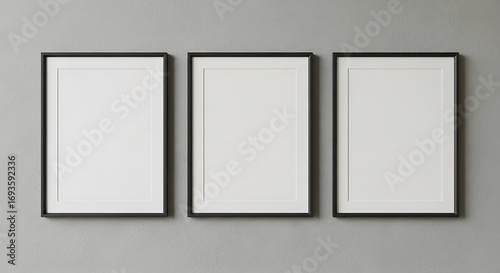 Three Empty Picture Frames on a Gray Wall.