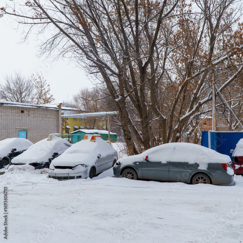 Cars covered with snow in Parking lot