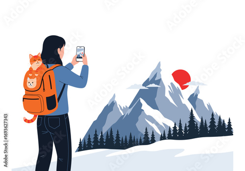 Woman captures scenic mountain landscape with a cat in a backpack