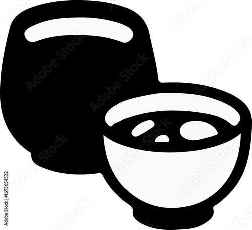 A bowl of miso soup and an empty bowl.