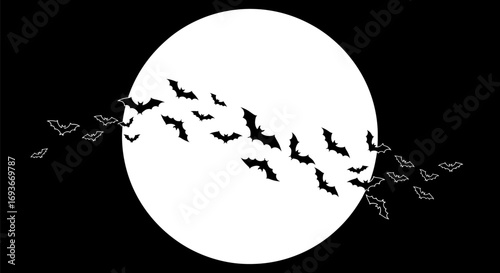 Silhouette of Bats Flying Before a Full Moon.