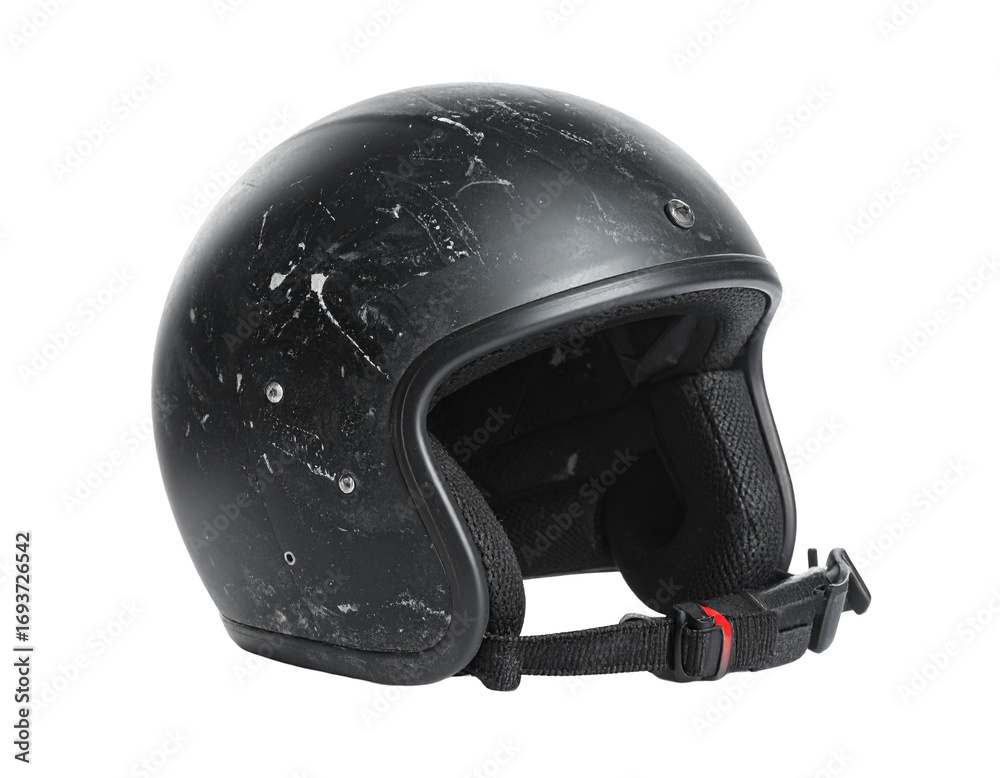 Fototapeta premium A dusty black vintage motorcycle helmet, isolated on a white background.