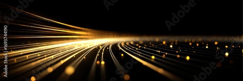 Abstract golden light trails on black background