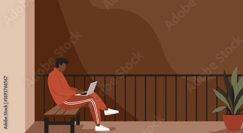 Young man in casual attire focused on his laptop on a balcony, embodying modern remote work, online learning, or leisure at home.
