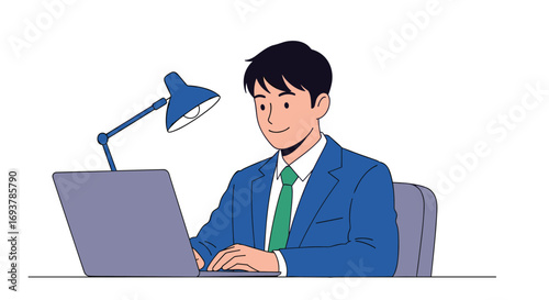 A young businessman works diligently at his desk under a bright lamp on his laptop