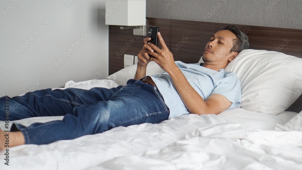 Fototapeta premium young man with mobile phone