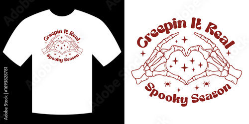 Spooky Season Tee: A captivating design graces a stylish tee, featuring the spirited phrase Creepin It Real Spooky Season