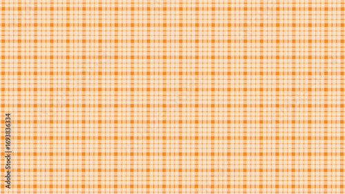 Orange and white plaid fabric texture background. Seamless pattern checkered wallpaper.	