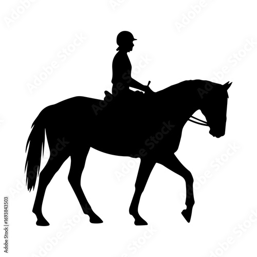 Silhouette of a jockey walking a horse