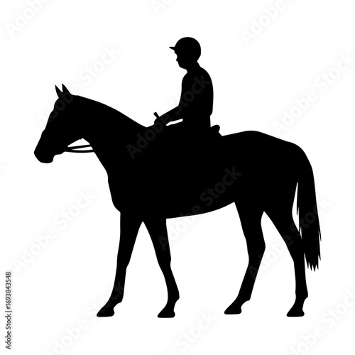 Silhouette of a jockey walking a horse