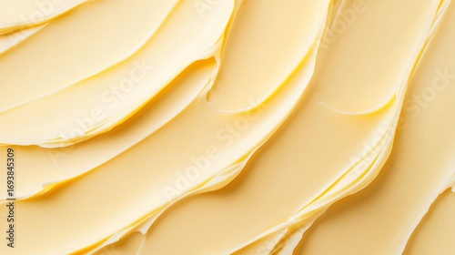 Yellow butter texture with large brush strokes, trendy color background with copy space for design or culinary concept