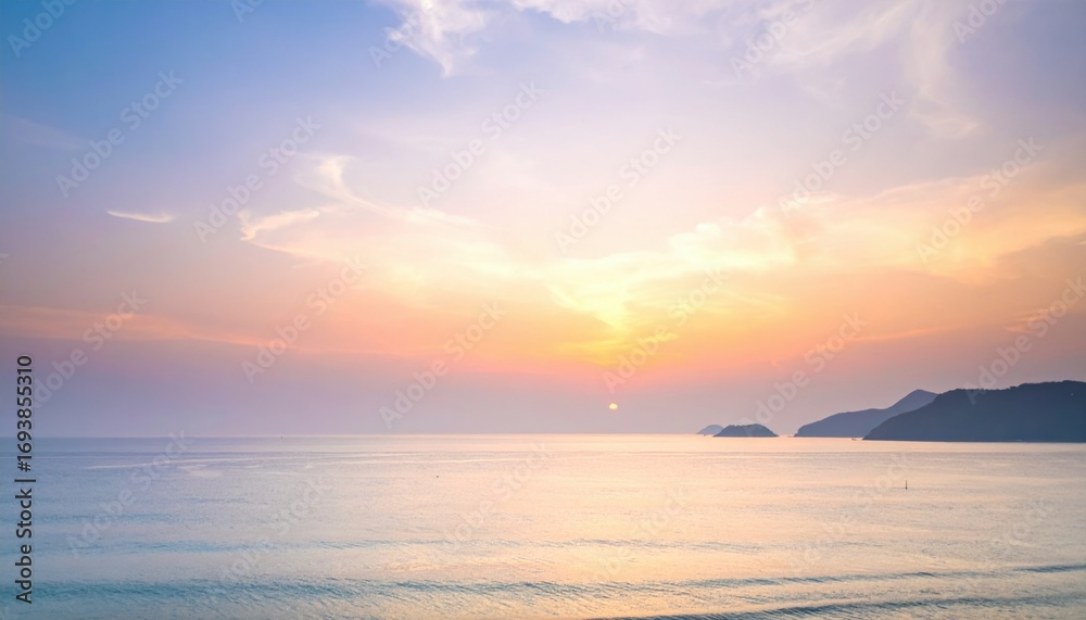 Fototapeta premium Soft dawn sea haze masking horizon upper frame wallpaper background representing atmospheric seascape suitable for calm natural design