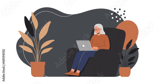 Elderly woman comfortably using a laptop in a cozy home setting. Represents remote work, online learning, or digital connection for seniors, highlighting an active, modern lifestyle.
