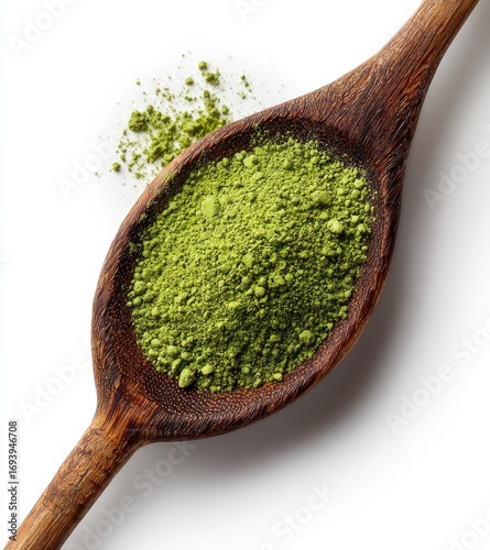 Green tea powder in wooden spoon