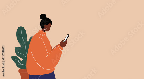 Young Black woman in a cozy sweater using a smartphone, depicting modern digital communication and online lifestyle.