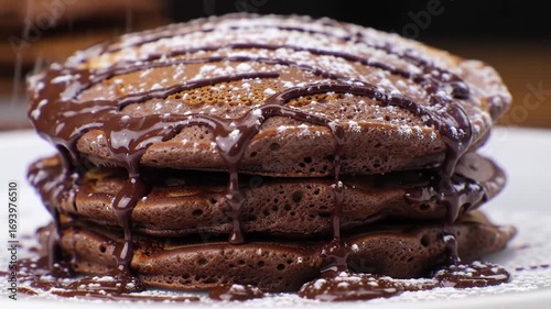 Stack of chocolatey pancakes with dusting