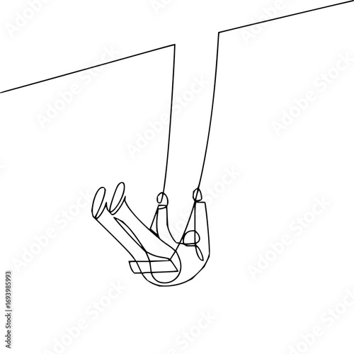 Joyful child's legs swinging high on a playground swing, capturing pure childhood freedom and delight.