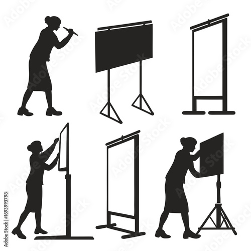 Silhouettes of people interacting with presentation boards whiteboard blackboard