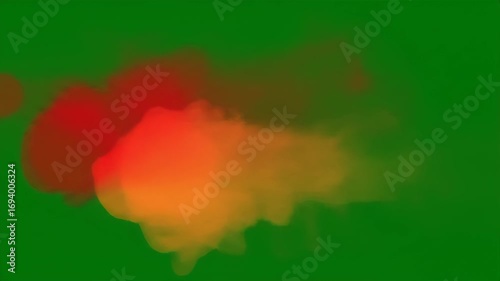 Abstract Animation of Red and Orange Smoke Clouds Against a Green Screen Backdrop
