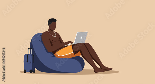 Relaxed man in swim shorts uses a laptop on a bean bag chair with luggage nearby, depicting a digital nomad lifestyle or remote work during travel and vacation.