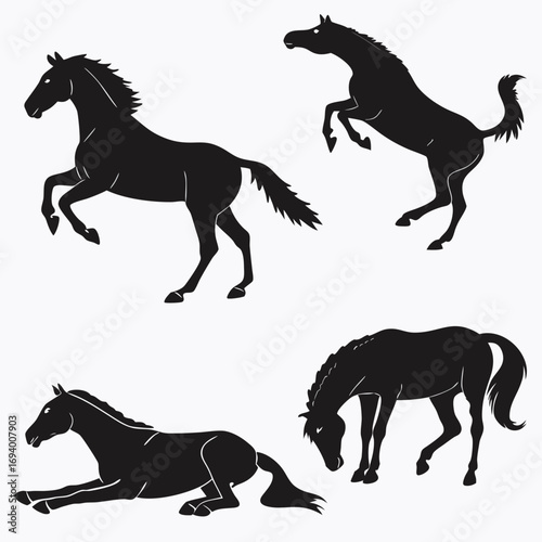 Four black horse silhouettes in various poses standing rearing