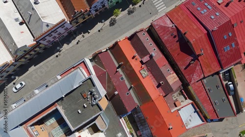 Birds-eye aerial drone view looking straight down onto the colorful, historic rooftops and streets of Havlickuv Brod, Vysocina, Czech Republic.