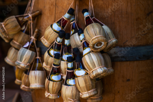 Traditional food and wine shop. San Gimignano, Toscana. Shop with traditional cheese, ham and wine.Small wine bottles for sale in a souvenir shop in Italy, typical Italian souvenir.