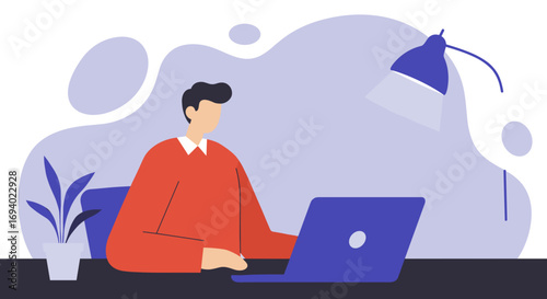 Focused man working remotely on his laptop at a modern desk with a plant and desk lamp, embodying productivity and online connectivity.