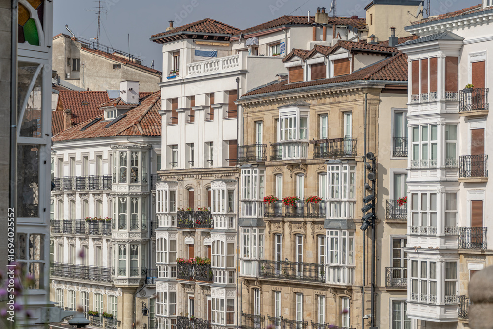 Fototapeta premium Ornate Balconies and Architectural Details on Old Buildings in Vitoria-Gasteiz, Spain. European Cityscape, Historic Architecture, Bay Windows
