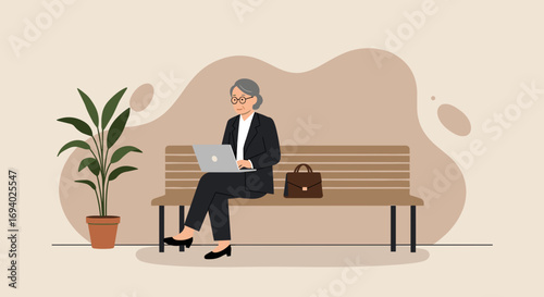 Experienced businesswoman in a suit works on a laptop on a bench, showcasing modern productivity and professional lifestyle.