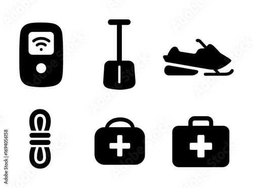 Essential winter survival gear: avalanche beacon, shovel, snowmobile, rope, first aid kits