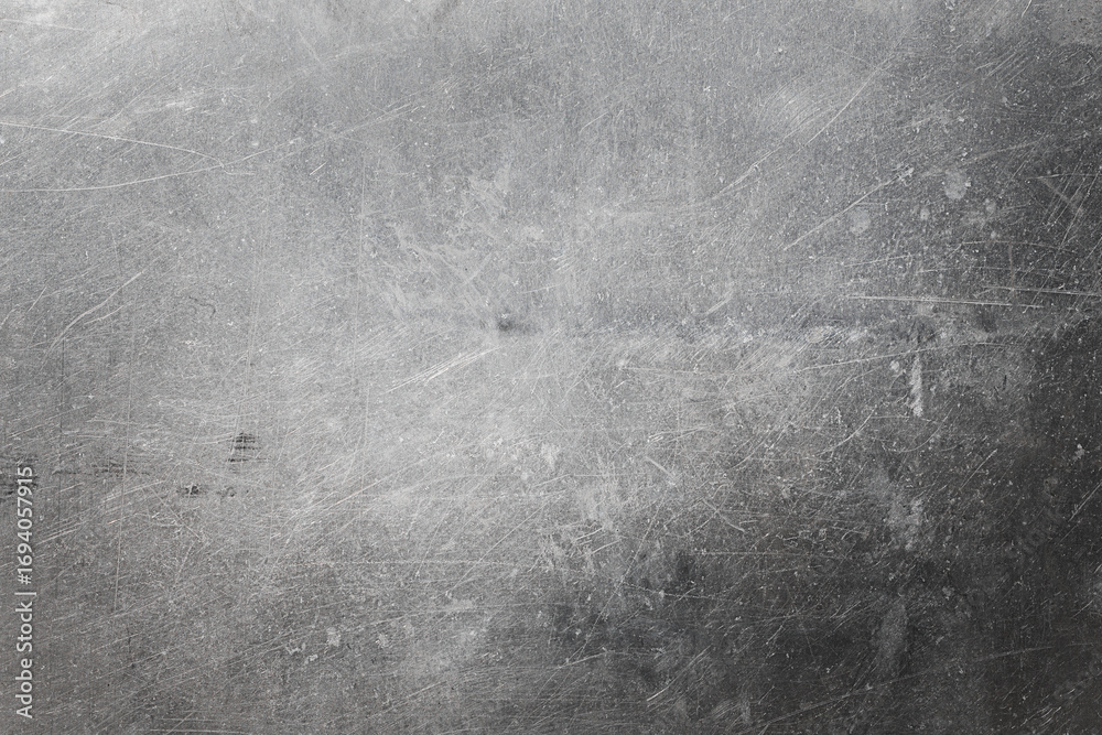 Naklejka premium background of grey scratched metal