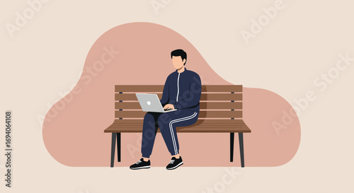 Young man in a tracksuit sits on a park bench, working remotely on his laptop. Represents freelance, remote work, or studying in a relaxed outdoor setting.