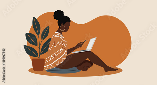 African American woman working remotely from home with laptop and smartphone, representing modern digital lifestyle, connectivity, and flexible work.