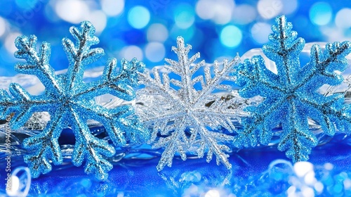 Festive blue snowflakes bokeh lights holiday card