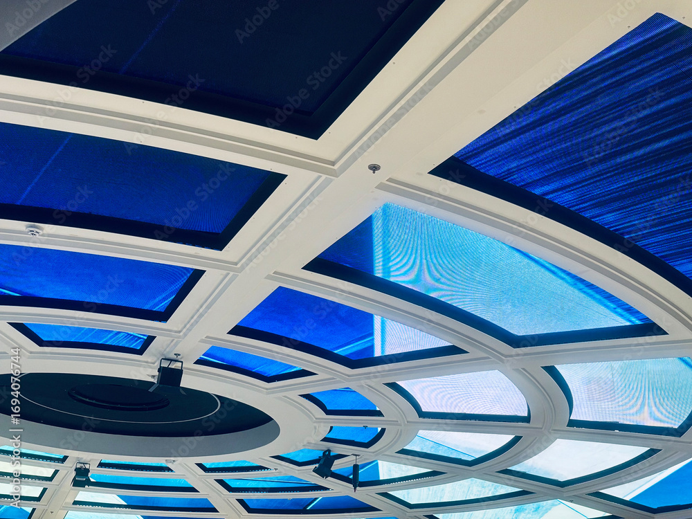 Obraz premium Futuristic design, concentric rings and radial segments illuminated with vibrant LED panels 
